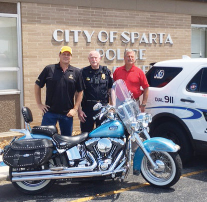 Marty (Selby) McFly, well known radio personality, is back again with his Shop With a Cop fundraiser. L-R: Marty (Selby) McFly, Sparta Police Chief Doug Goff, and McFly’s brother, Lt. Allen Selby, of Sparta Police Department.